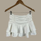 Falda Short Floppy blanco + Accesorio GRATIS